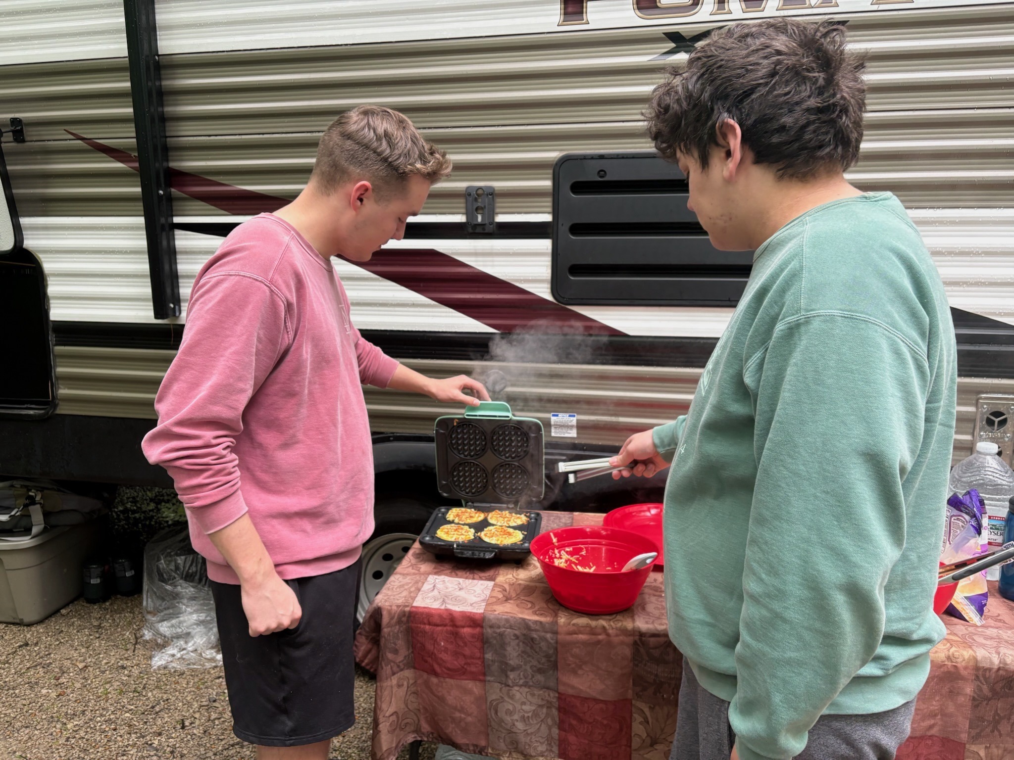 2025 FCF Lara 03 Two boys cooking waffles using a waffle iron