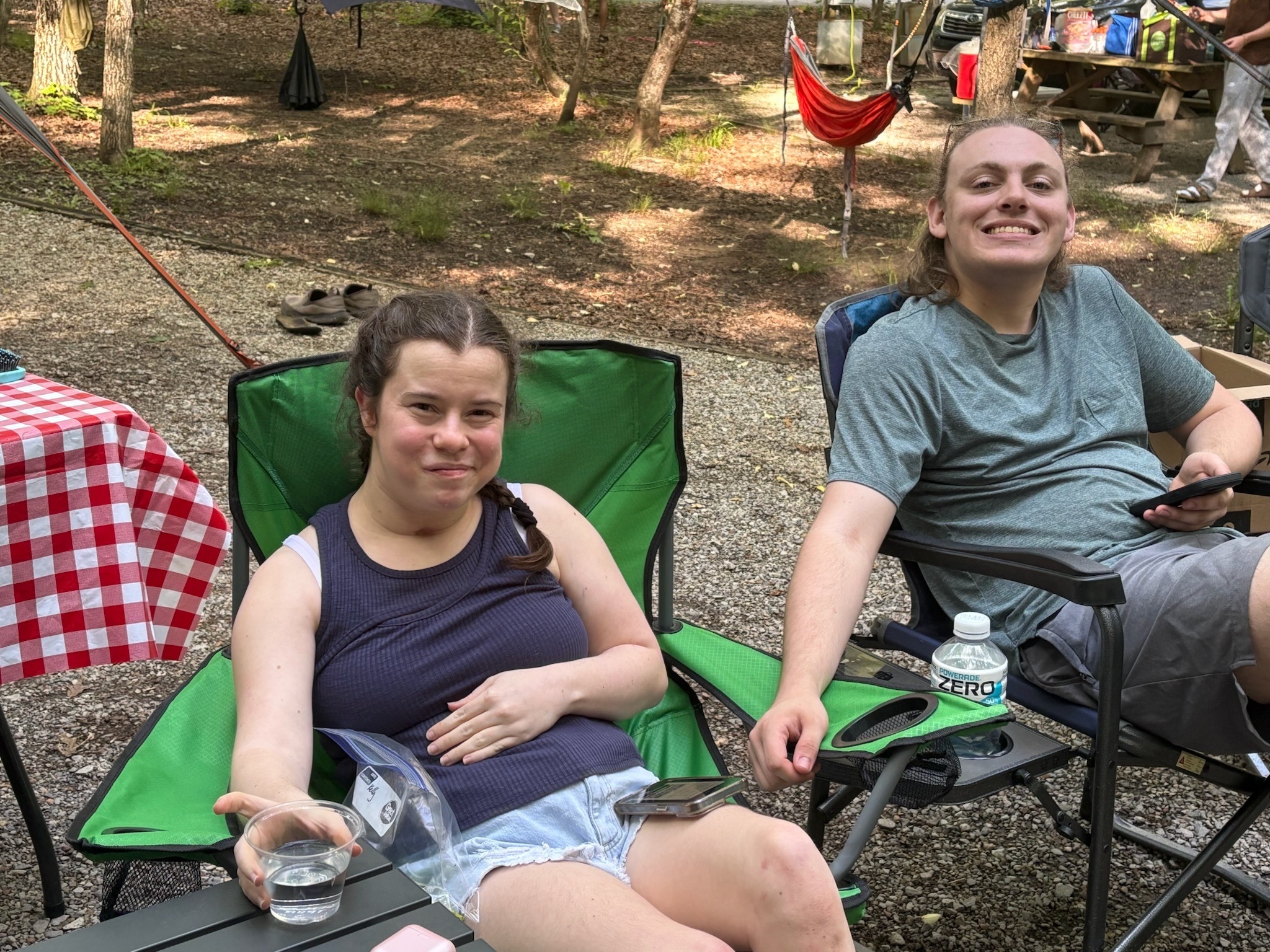 2025 FCF Lara 11 Kelly Peterson and Matthew sit side by side in camp chairs in the campground